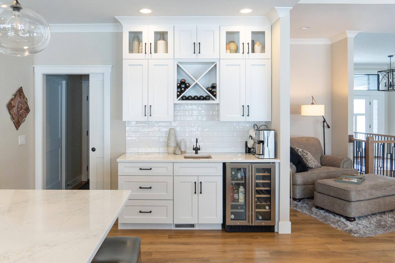 White subway tile and cabinets coffee bar