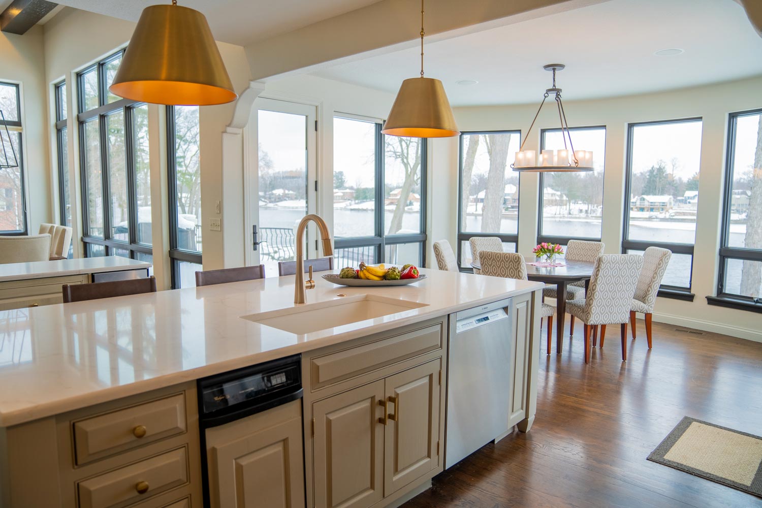 Riverfront Abode's kitchen island and breakfast nook overlooking the river