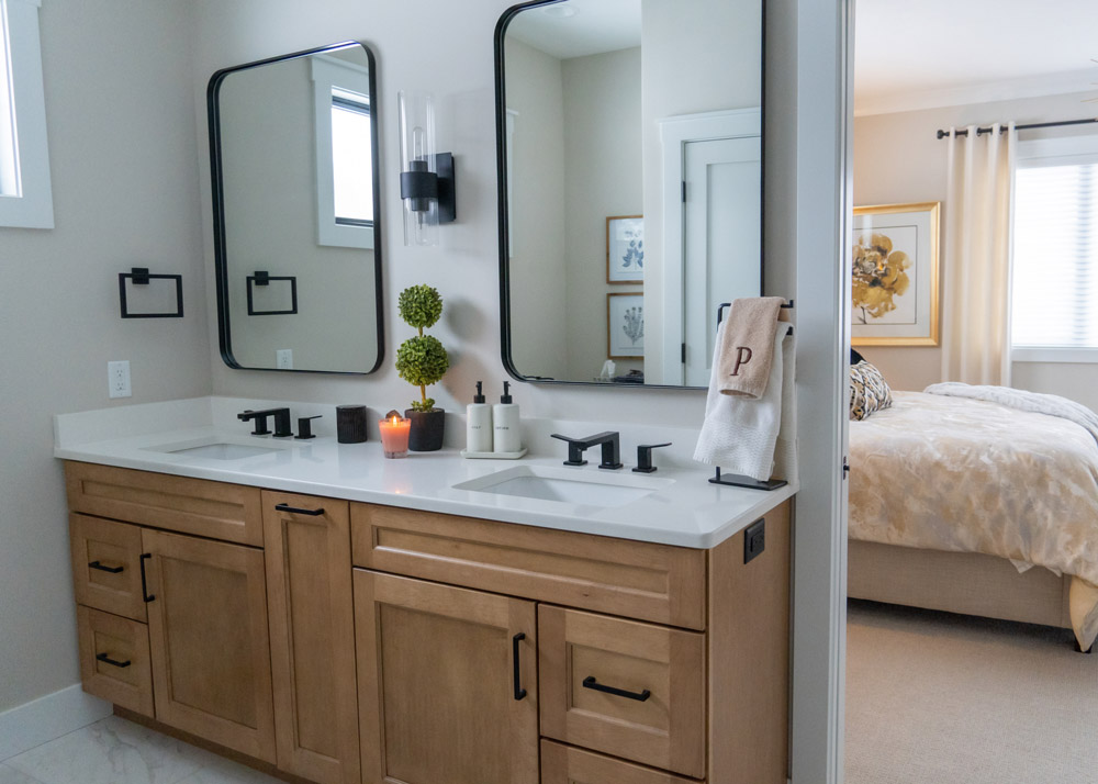 Bungalow Homestead's double-vanity master bathroom looking into the master bedroom