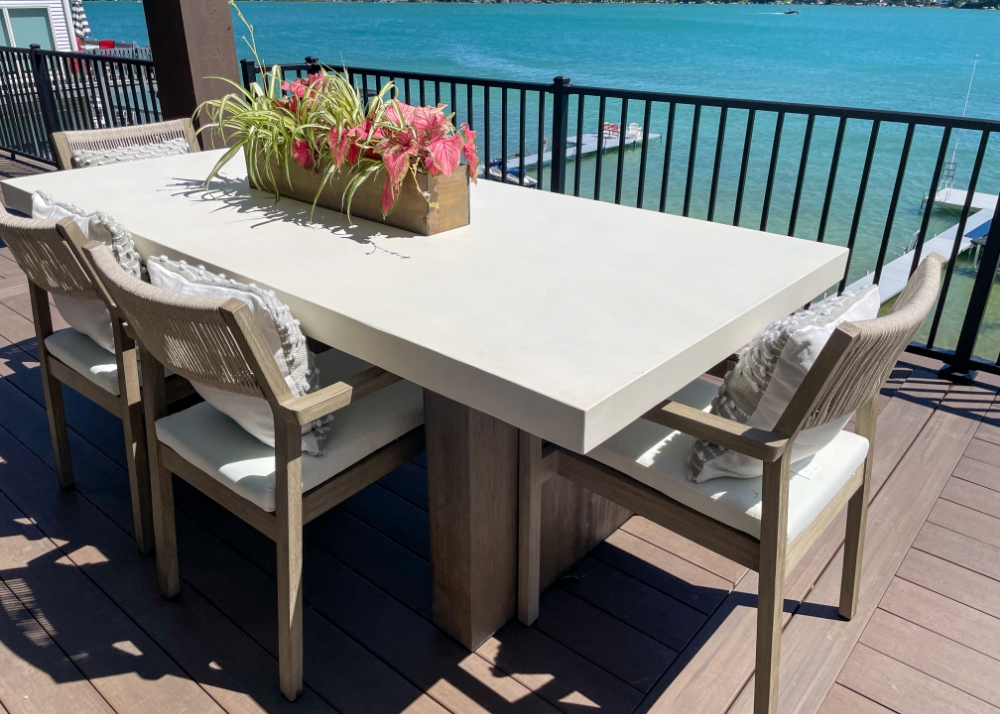 Parade of Homes 2022's outdoor dining area overlooking the blue lake