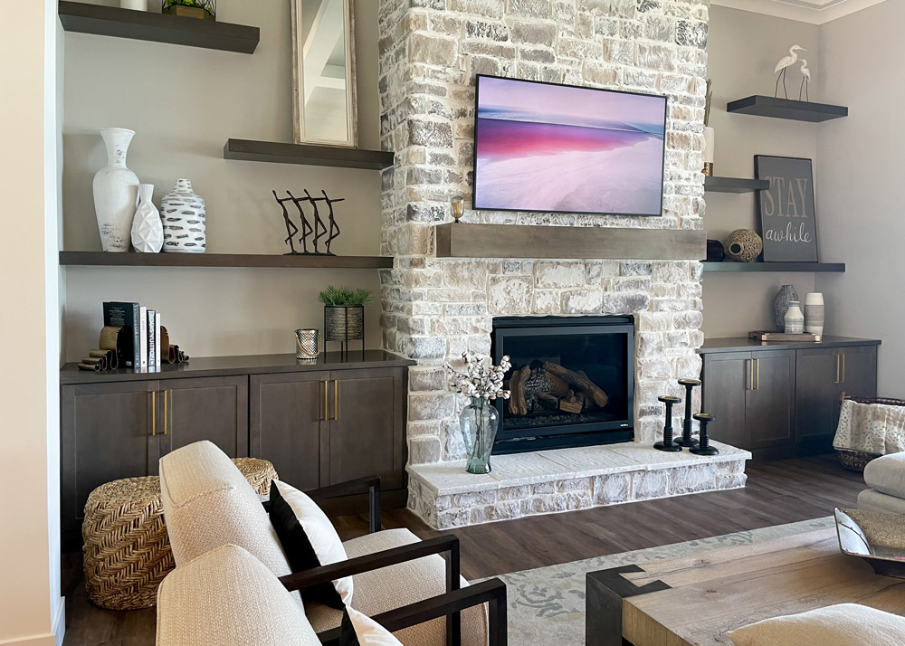 Parade of Homes 2022's custom-designed fireplace with built-in cabinetry