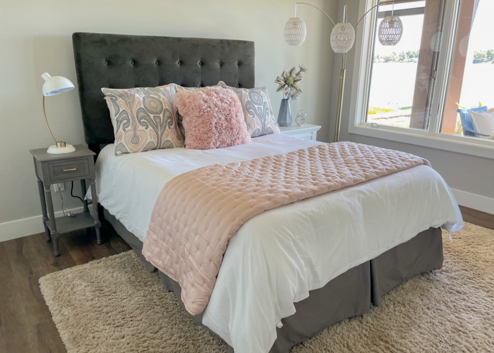 Parade of Homes 2022's guest bedroom with pink and gray decor