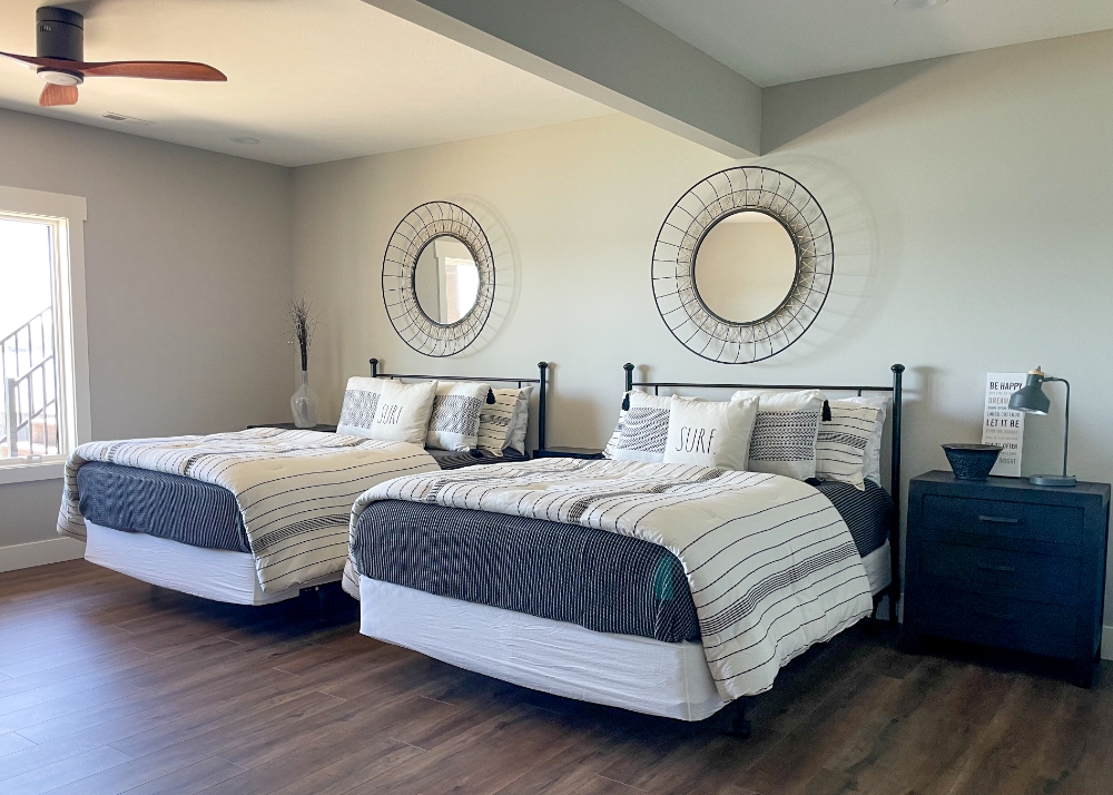 Parade of Homes 2022's guest bedroom with two queen size beds and modern decor