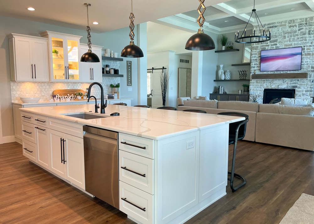 Parade of Homes 2022's kitchen island overlooking the great room