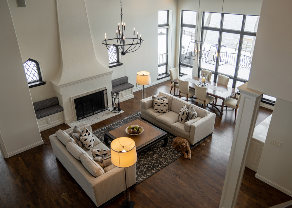 Riverfront Abode's great room surrounds the fireplace and the dining area overlooks the river